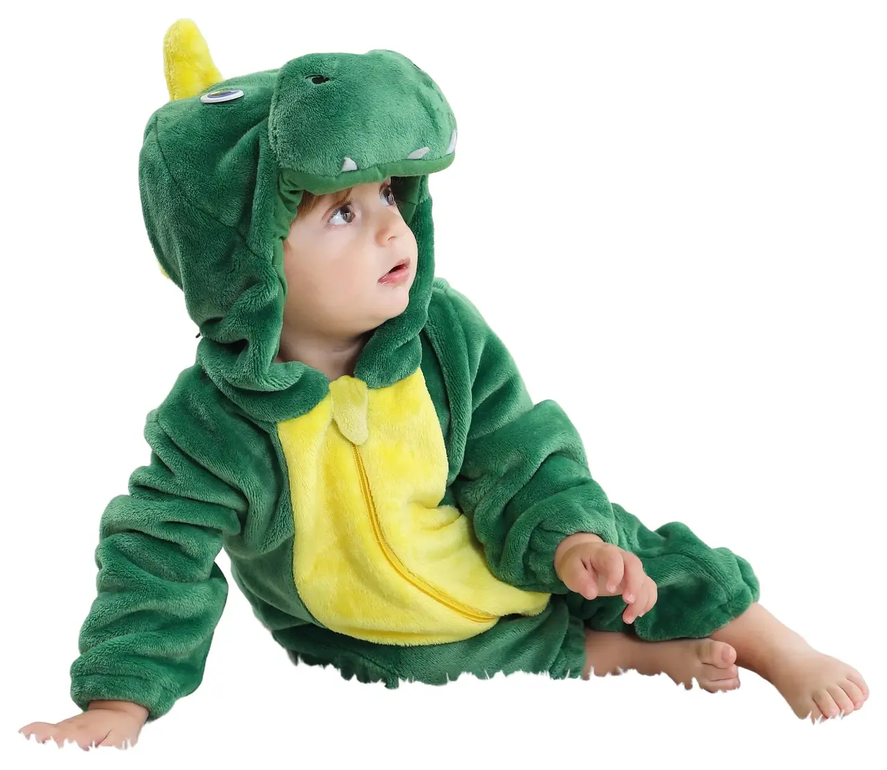 Et blødt og nuttet grønt T-Rex kostume til børn, lavet af behageligt flannelmateriale. Dragten har en sjov hætte med dinosauransigt og hvide tænder samt en lille hale bagpå.